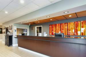 a lobby of a hospital with a reception counter at Days Inn & Suites by Wyndham Johnson City in Johnson City