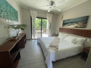 Ένα ή περισσότερα κρεβάτια σε δωμάτιο στο Casa Tulum Hotel