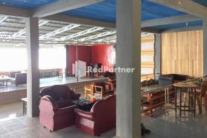 Гостиная зона в Aquino Marito Homestay Mitra RedDoorz