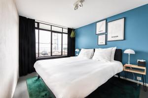 Postel nebo postele na pokoji v ubytování Gooiland Hotel