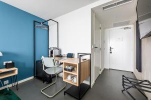 TV a/nebo společenská místnost v ubytování Gooiland Hotel