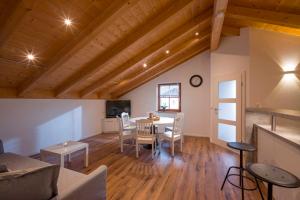 a living room with a table and a dining room at Ferienwohnung Hofmann in Kiefersfelden
