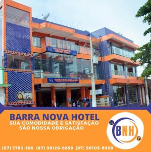 a building with a sign in front of it at Barra Nova Hotel in Saloá