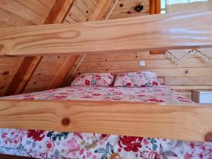 A bed or beds in a room at Guest House Rankić