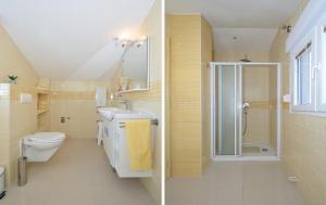 a bathroom with a toilet sink and a shower at Villa Klaudia in Trogir