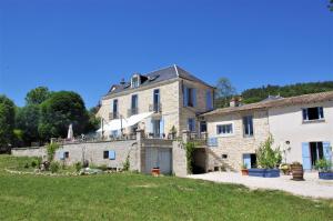 a large stone house with a yard at Villa Panama in Barbirey-sur-Ouche