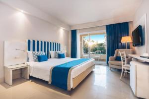a hotel room with a bed and a balcony at Iberostar Selection Diar El Andalous in Port El Kantaoui