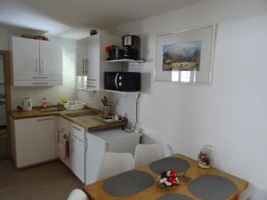 Kuchyň nebo kuchyňský kout v ubytování Apartment Tjaša