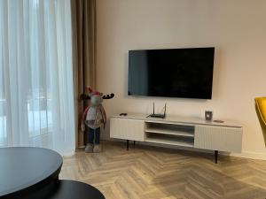 TV a/nebo společenská místnost v ubytování Apartament Sweet Dream Longinówka