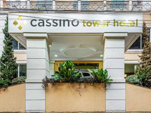 a building with a sign that reads casina tokyo hotel at Hotel Cassino Tower Campinas Cambuí in Campinas