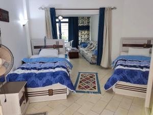A bed or beds in a room at 2bed rooms 95m, Garden&sea view, first floor, Family only دور اول بمدخل مستقل