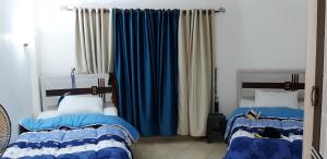 A bed or beds in a room at 2bed rooms 95m, Garden&sea view, first floor, Family only دور اول بمدخل مستقل