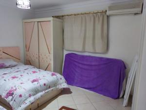 A bed or beds in a room at 2bed rooms 95m, Garden&sea view, first floor, Family only دور اول بمدخل مستقل