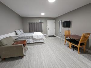TV a/nebo společenská místnost v ubytování Riverside Motel