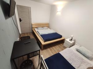 Łóżko lub łóżka w pokoju w obiekcie Night Point