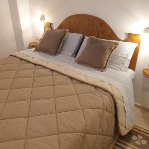 Postel nebo postele na pokoji v ubytování B&B Dei Cardinale