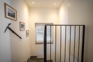 a staircase with a rail and a window in a room at Modern apartment with Matterhorn view in Zermatt