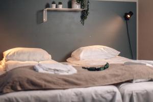 Postel nebo postele na pokoji v ubytování Lødingen Brygge