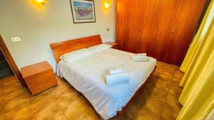 Tempat tidur dalam kamar di Appartamento Smith Grignolino - Affitti Brevi Italia