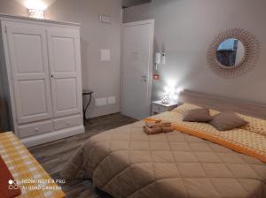 A bed or beds in a room at Case Vacanza Le Casette