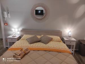 A bed or beds in a room at Case Vacanza Le Casette