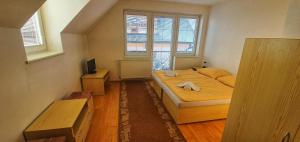 A bed or beds in a room at Privat Ivan
