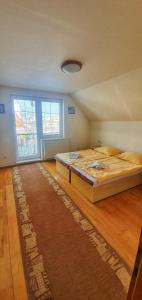 A bed or beds in a room at Privat Ivan