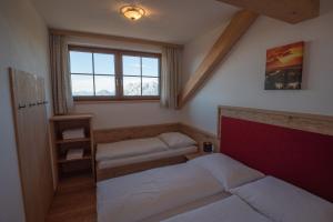 Posteľ alebo postele v izbe v ubytovaní d'Genussalm by Alpine Genusswelten
