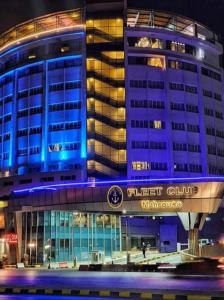 a building with blue lights on top of it at Fleet Club Mahrousa in Alexandria