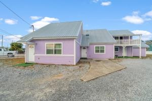 a pink house with a grey roof at 5218 Beach Dr A in Panama City Beach