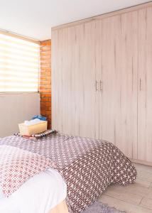 Cama o camas de una habitación en Vineyard Apartments & Suits