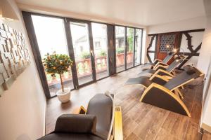 a row of chairs in a room with large windows at Hotel Doctor Weinstube in Bernkastel-Kues