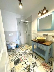 a bathroom with a sink and a shower and a toilet at My Adress Alaçatı Butik Otel in Alacati