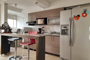 Virtuvė arba virtuvėlė apgyvendinimo įstaigoje Espectacular apartamento via Cerritos 8 personas