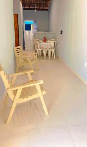 a room with two chairs and a table at Casa em São Miguel dos milagres. in São Miguel dos Milagres