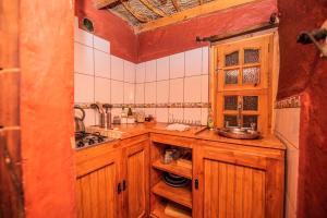 Kuchyň nebo kuchyňský kout v ubytování Incahuasi Travelodge