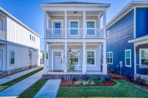 a white house with a blue at Downtown Livin' in Pensacola