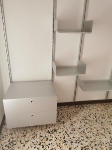 a white refrigerator with a drawer and shelves at Ca Cristallina in Venice
