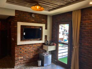 TV a/nebo společenská místnost v ubytování Vila NJD