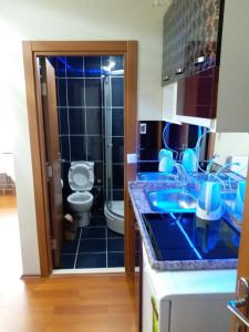 a bathroom with a sink and a toilet in it at Ceylan Apart Otel in Tekirdağ