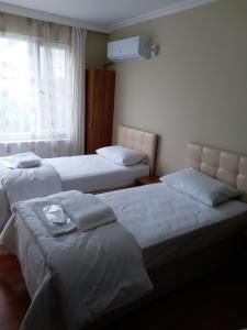 Кровать или кровати в номере Ceylan Apart Otel