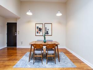 a dining room with a table and chairs at Spacious Old City Loft in Knoxville