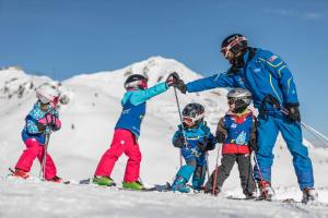 a group of people on skis in the snow at Appartements Hartlbauer in Dorfgastein