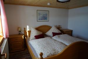 Un pat sau paturi într-o cameră la Knuschbrhaisle