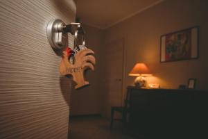a door knocker hanging on a wall in a room at L'Adret in Aosta