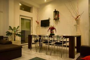 a living room with a dining room table and chairs at Nature Lanka Guest House in Negombo