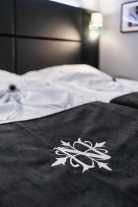 Postel nebo postele na pokoji v ubytování Hotel NOIR