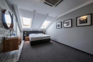 Postel nebo postele na pokoji v ubytování Hotel NOIR