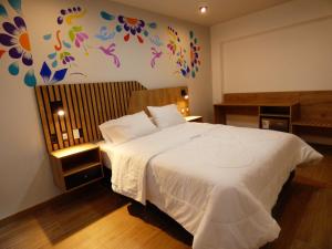 Postel nebo postele na pokoji v ubytování Platero Hotel