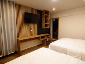Postel nebo postele na pokoji v ubytování Platero Hotel